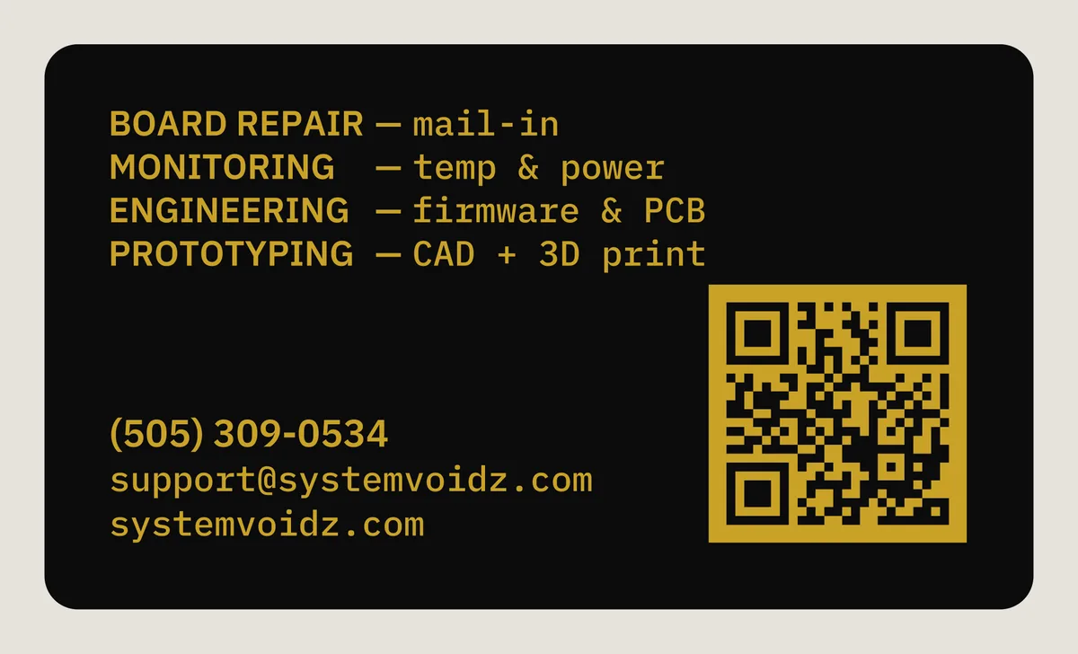 Back of the same black metal business card: a list of services, phone number, email, web address, and an engraved QR code.